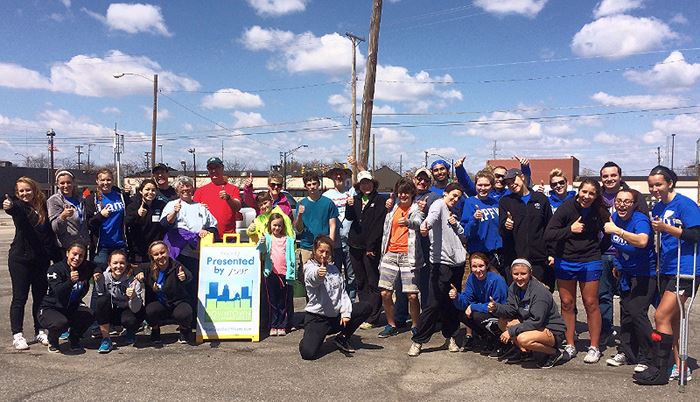 There are many volunteer opportunities around town for groups to take part in! (photo via the Downtown Improvement District)