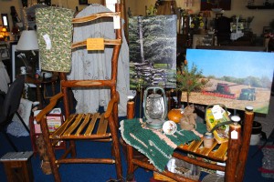 A sassafras chair, some photography, and other items created by local artists available at the Red Horse Livery in Coatesville.