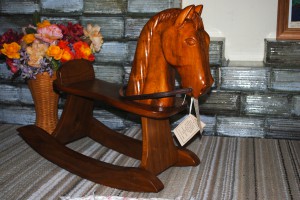 This rocking horse was handcrafted by a local man who is now unable to work with wood due to health issues. This is one of his last pieces, available at the Red Horse Livery.