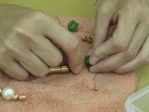 Karen Pumphrey stringing beads for blog Gallery on the Square, Danville Indiana