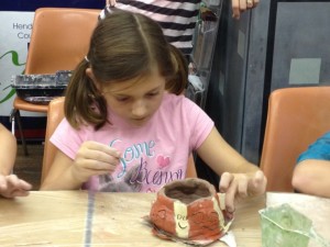 One of the girls working on her pumpkin/ghost bowl.