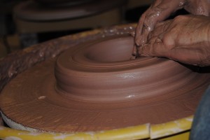 Turning a block of clay into a work of art.