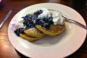 Blueberry pancakes with whipped cream