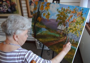 One of Sally's students working on painting.