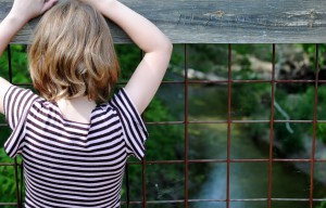 My daughter enjoys the view from the old train trestle over Crittenden Creek.