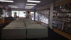 The center of the room is filled with boxes of comic books