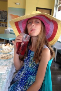 My daughter enjoying her hat and tea.