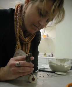 Pamela Powell Warden decorates a snowman for the season.