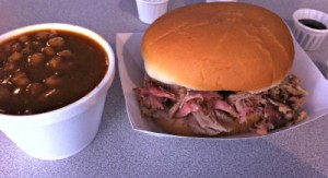 pulled pork sandwich and a side of baked beans