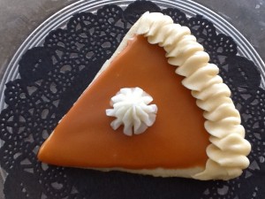A sugar cookie decorated as a slice of pumpkin pie at Sweetheart Cupcakes.