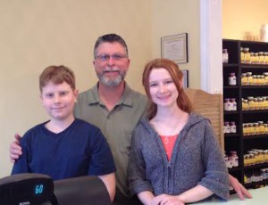 Owner of Real Food Shoppe Bob Ridenour with two of his children.