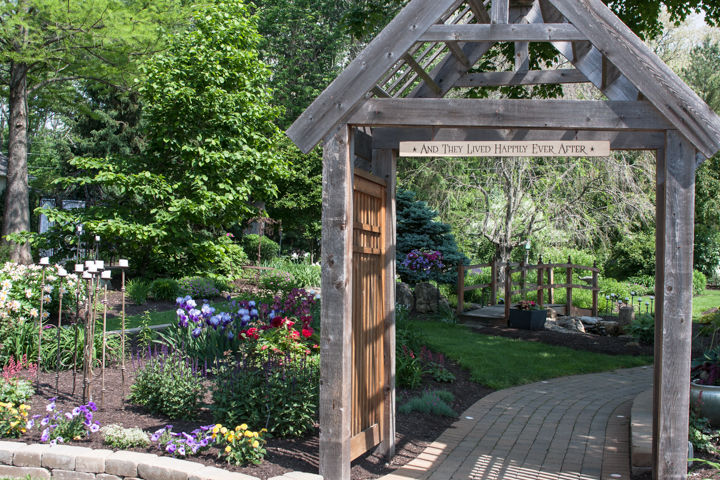 On the walk from the ceremony to reception area, a rustic archway welcomes guests as they pass from one part of an event to another.