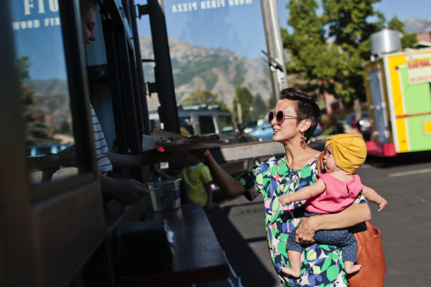 Mom ordering from a food truck