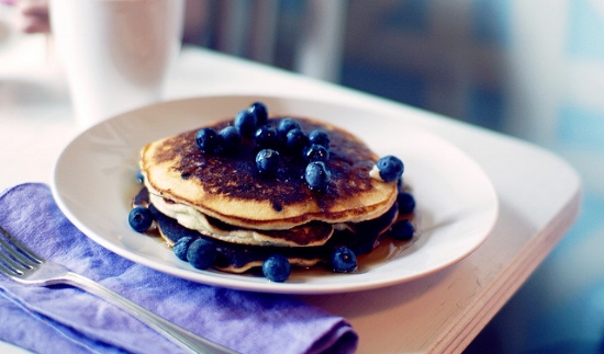 Pancakes topped with fresh blueberries