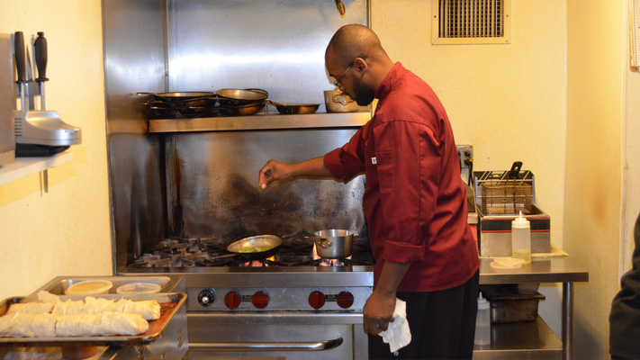 Chef Timothy Thomas prepares one of Flora's signature dishes. Chef Timothy Thomas prepares one of Flora's signature dishes.