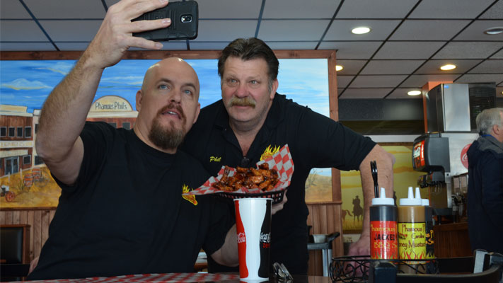 Notorious B.O.B. poses with Phamous Phil's owner Phil Schmidt. Notorious B.O.B. poses with Phamous Phil's owner Phil Schmidt.