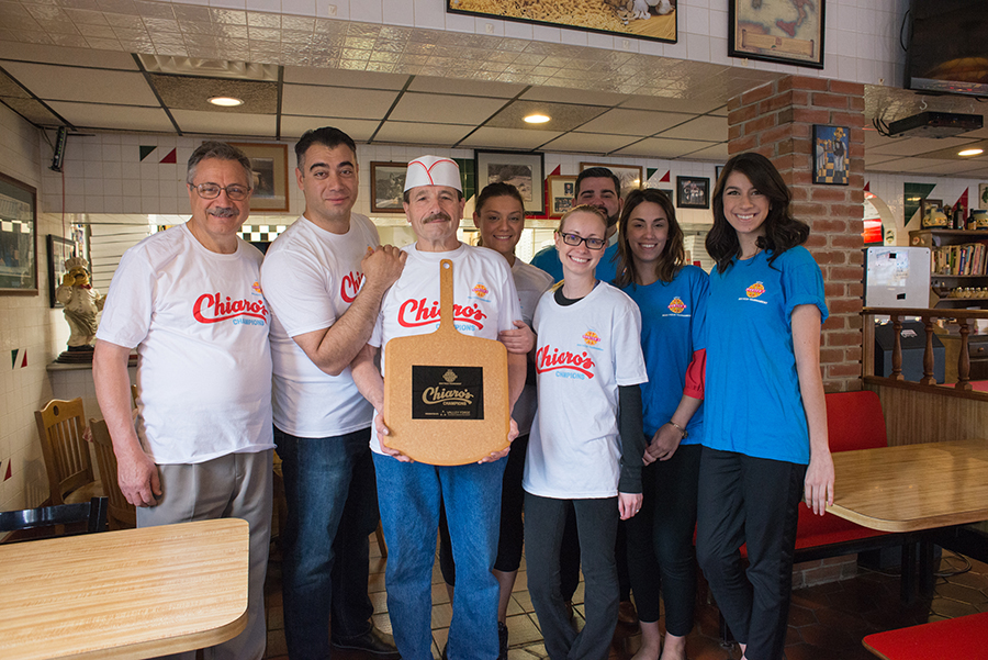 Chiaro's Pizza and Our Staff Show Off the Trophy