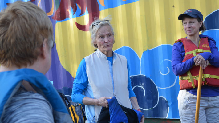 Robin Parker (center) offers instruction to some of her rowers.