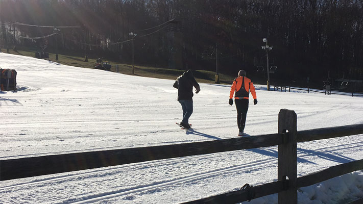 Our blogger (left) learns the basics from pro snowshoer Ed Myers.