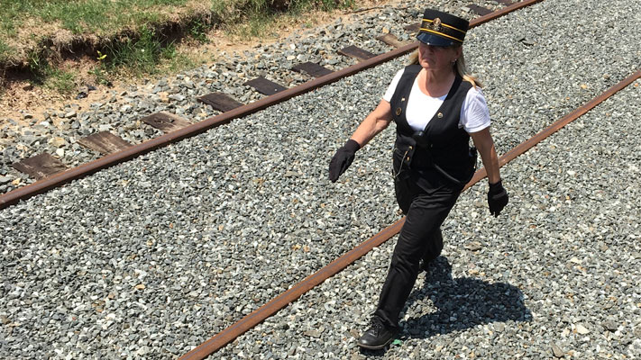 The conductor is in charge of the train, and Bonny Mallon takes the responsibility seriously. The conductor is in charge of the train, and Bonny Mallon takes the responsibility seriously.