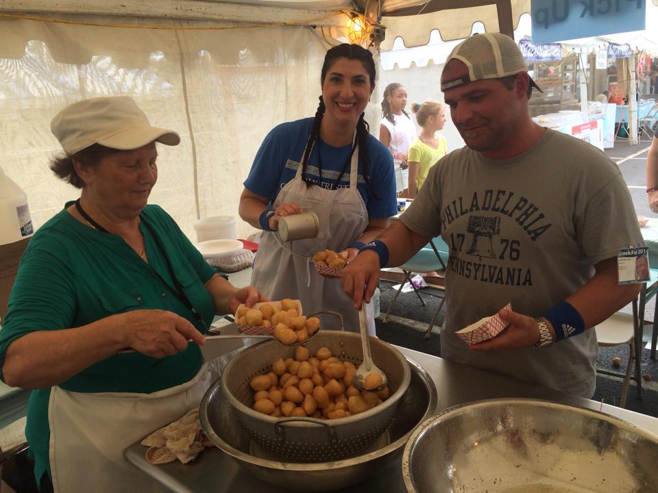 Serving up Loukoumades- aka tasty fried dough balls Greekfest dessert
