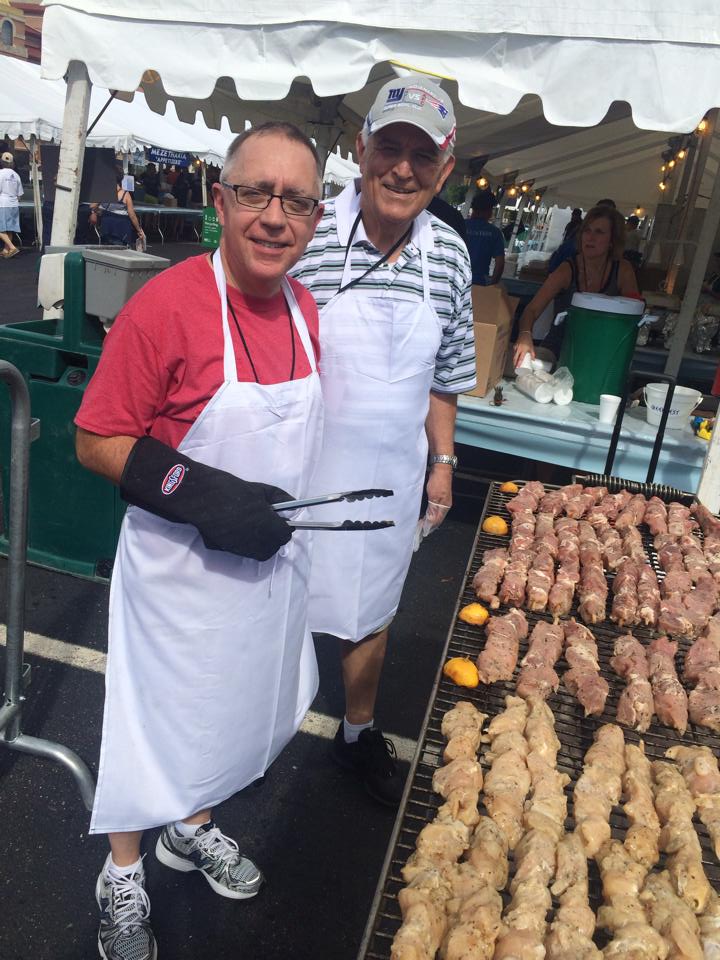 Souvlakia sizzling on the grill Cooking at Greek Fest