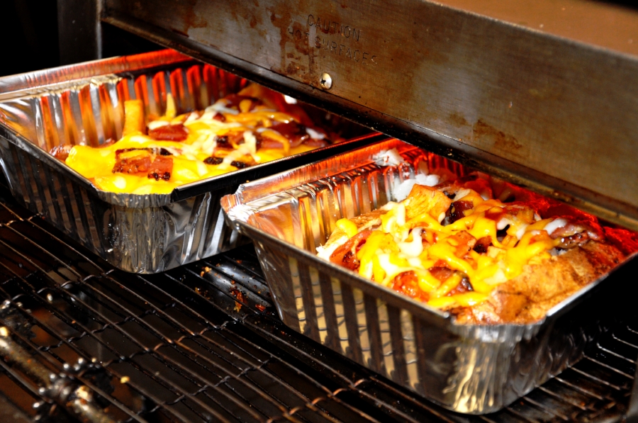 Baked potatoes coming out of the oven