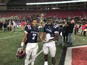 Football players holding trophy