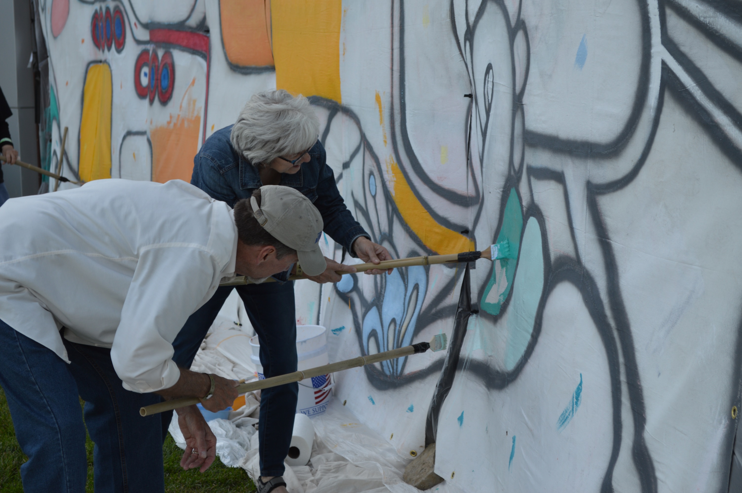 Couple painting part of the yellow submarine