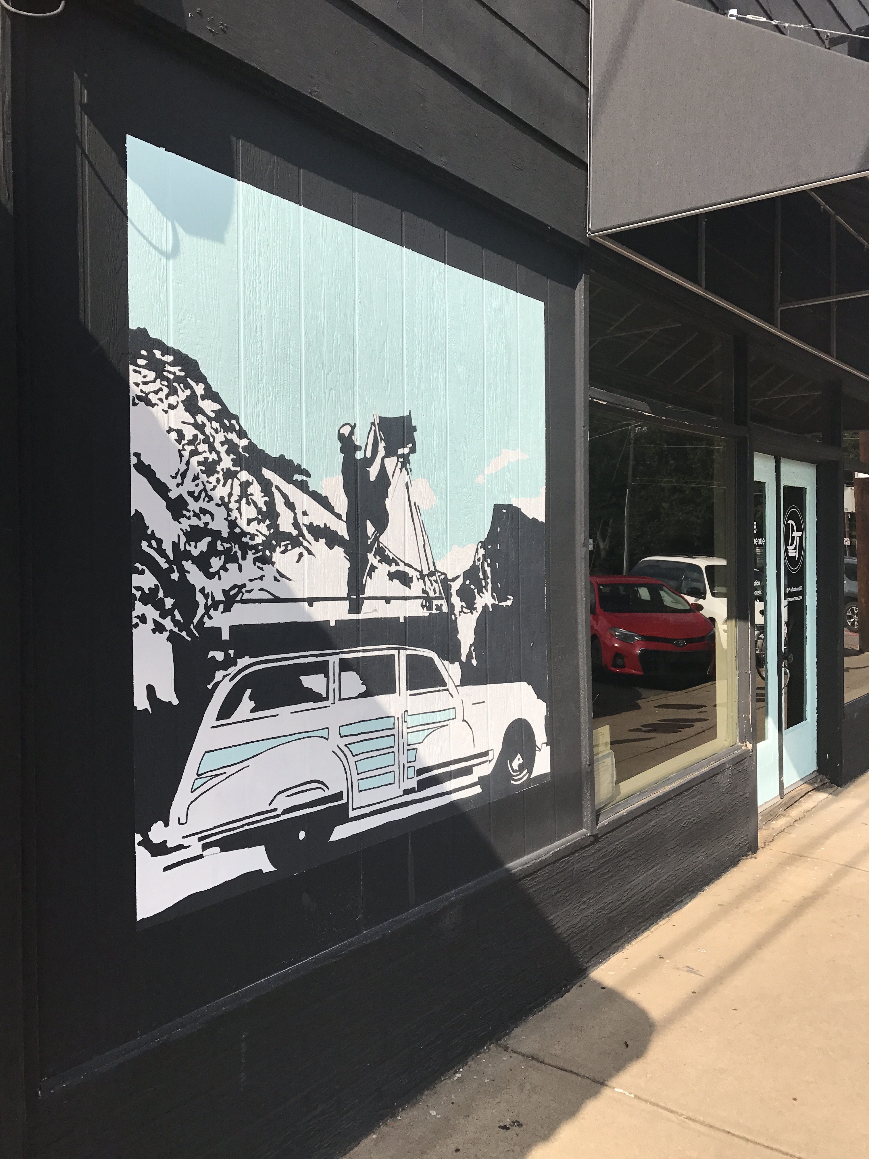 A mural picturing a car in Normaltown, Athens, GA.