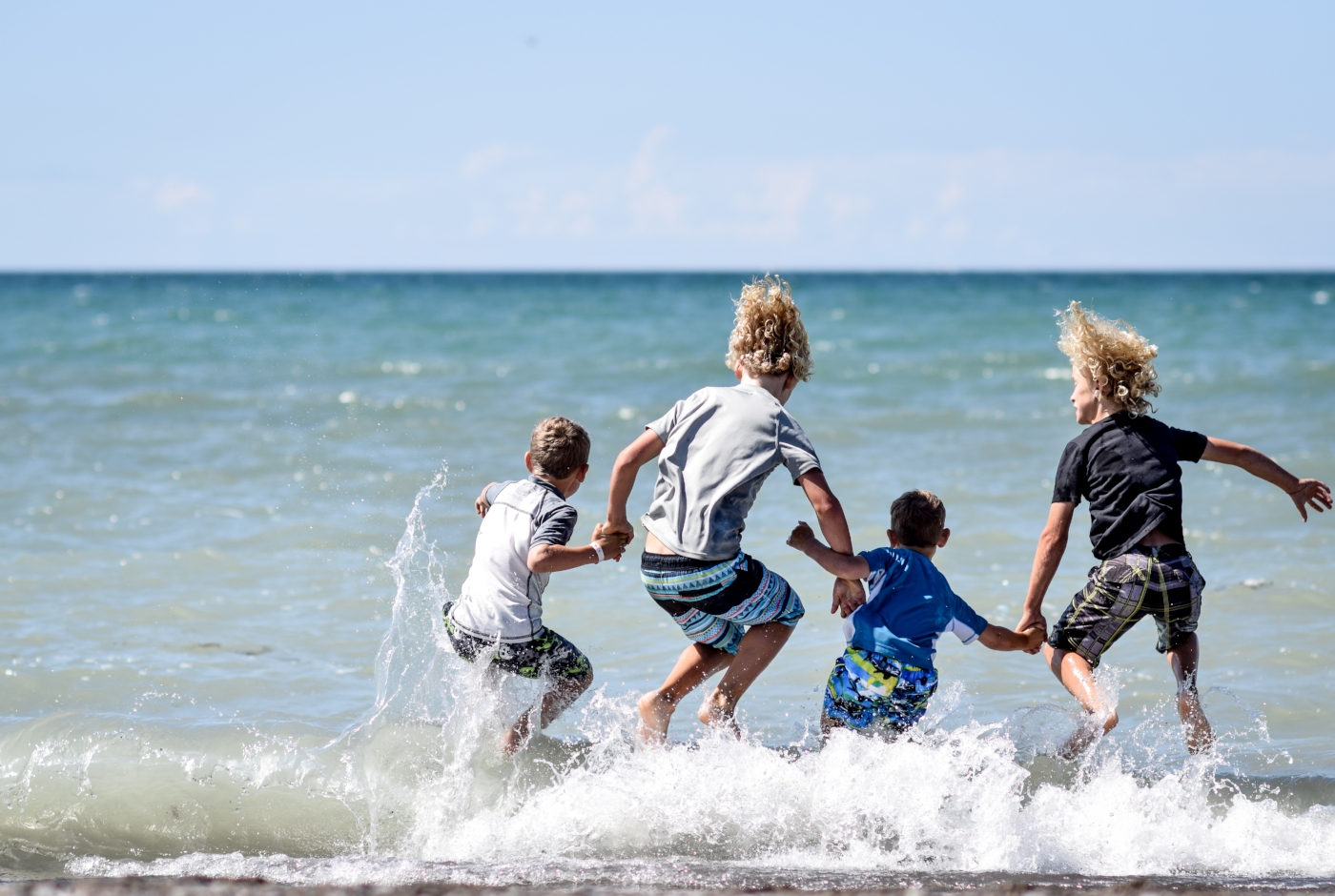 Kids jumping at erieau beach