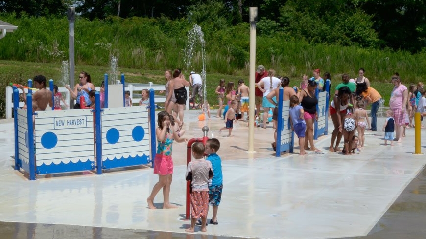 Families playing at New Harvest Splash Pad