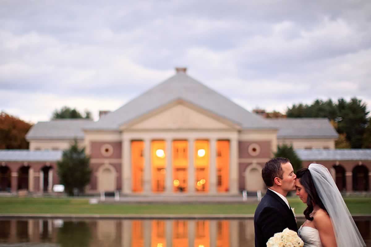 Groom kissing bride's forehead in saratoga spa state park