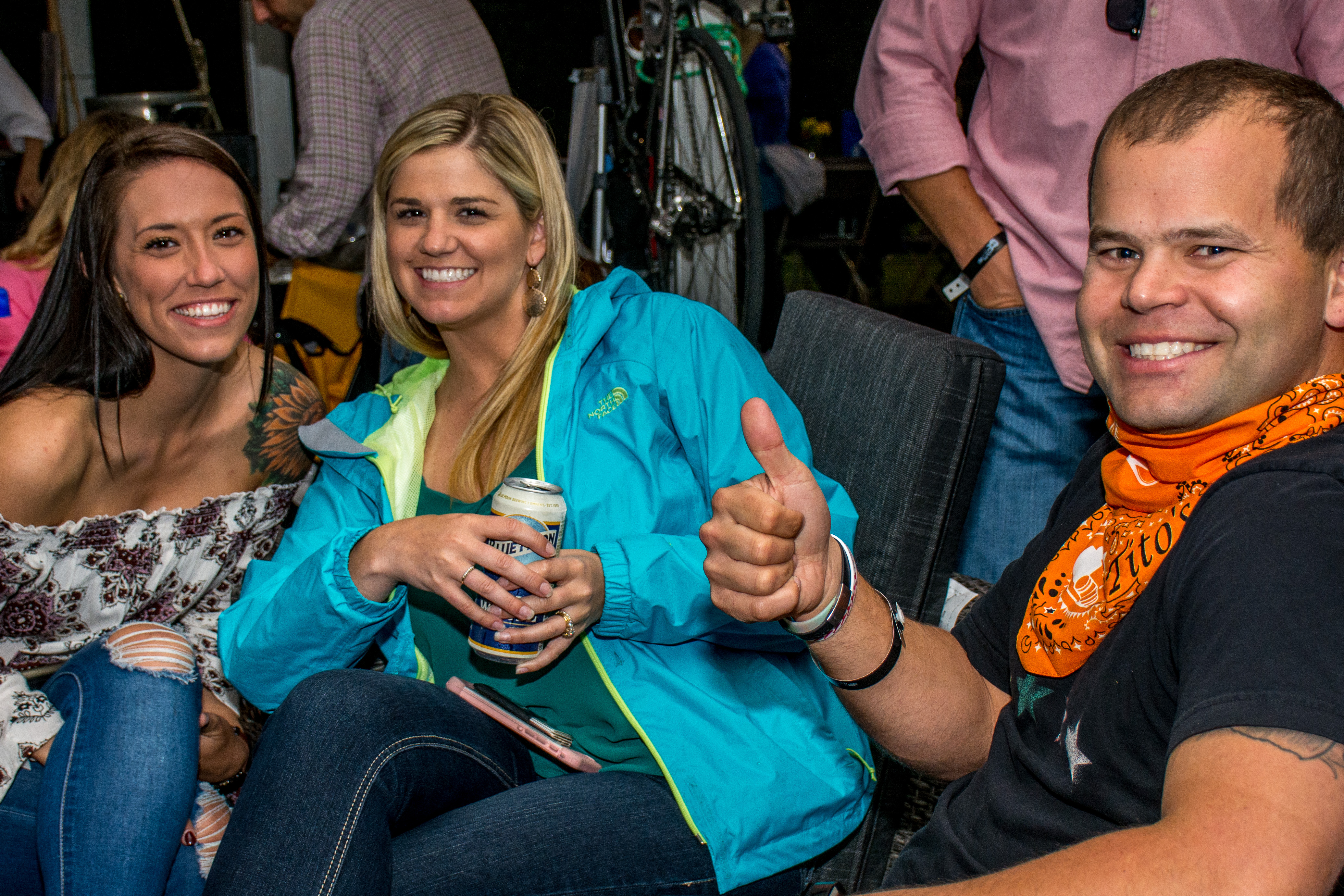 Two women and a man smiling and enjoying Food That Rocks 2017 in Sandy Springs.