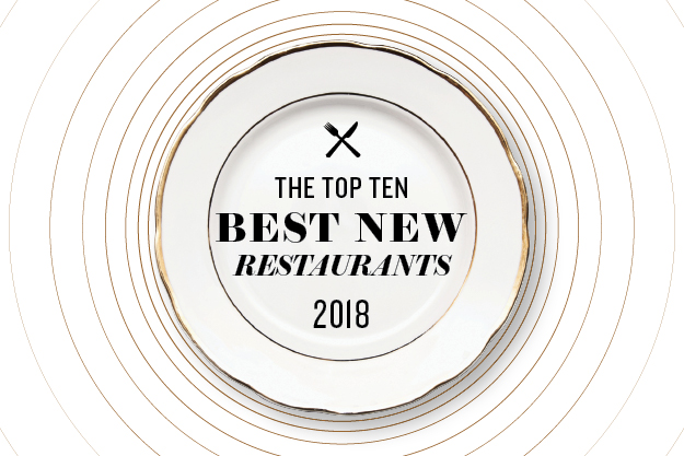 A white china plate with the words The top ten best new restaurants 2018 written on it
