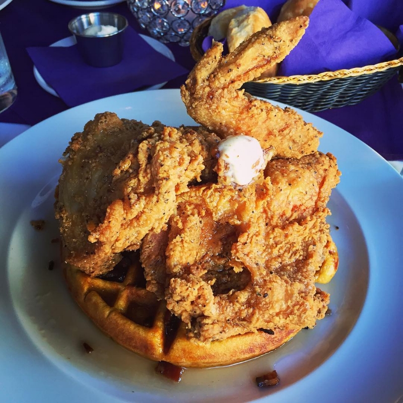 a blue plate heaped with fried chicken at the purple poulet bourbon bistro