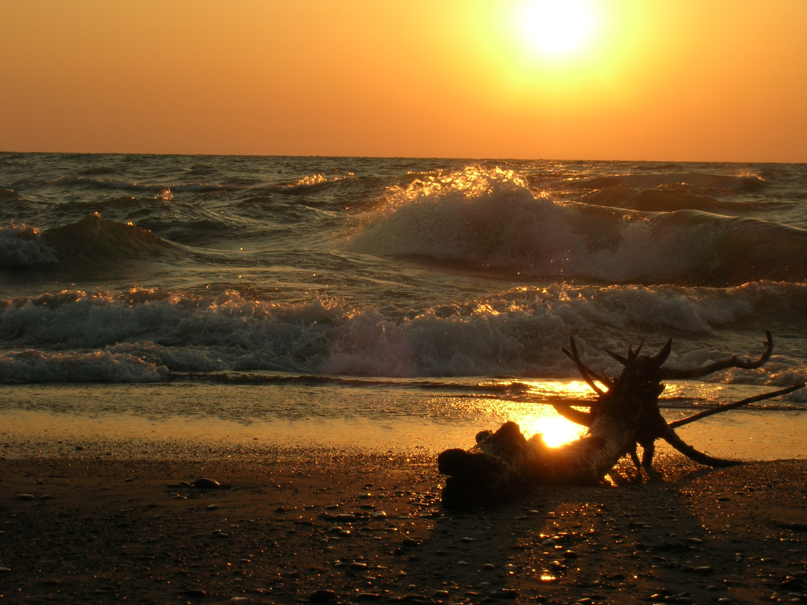 sunset on the water in grand bend