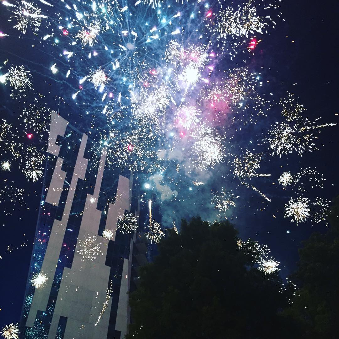 White fireworks exploding around the Ascent in Covington Kentucky