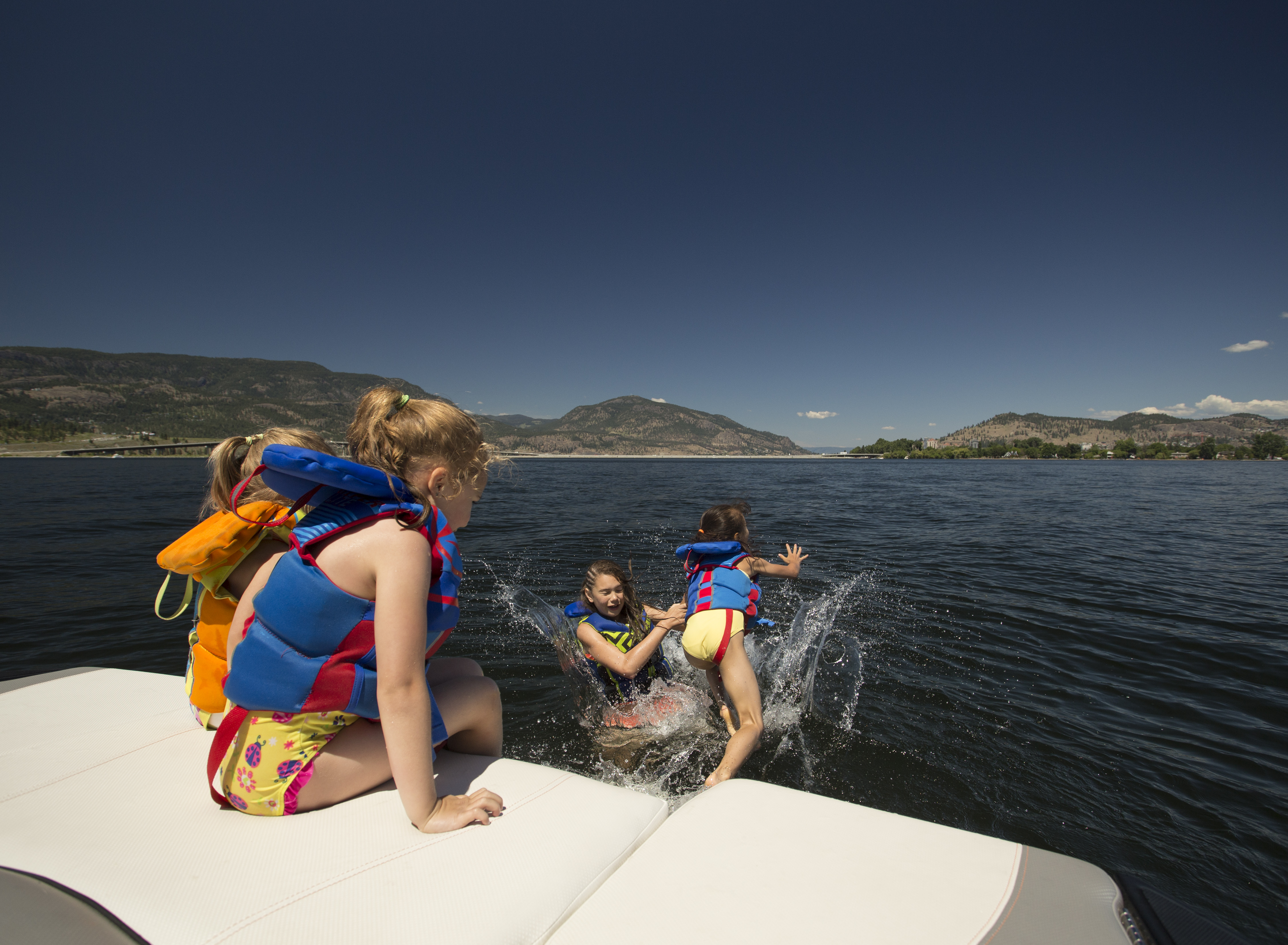 Girls Jumping into the Lake