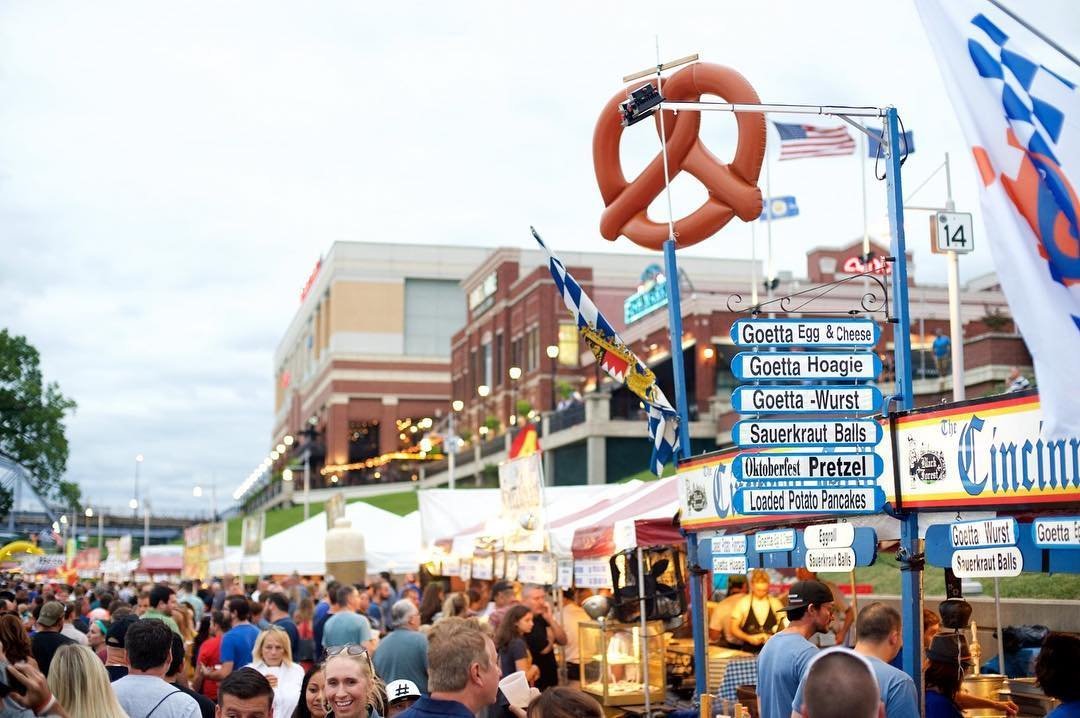 A big crowd at Goettafest at Newport on the Levee with signs hanging above naming goetta dishes