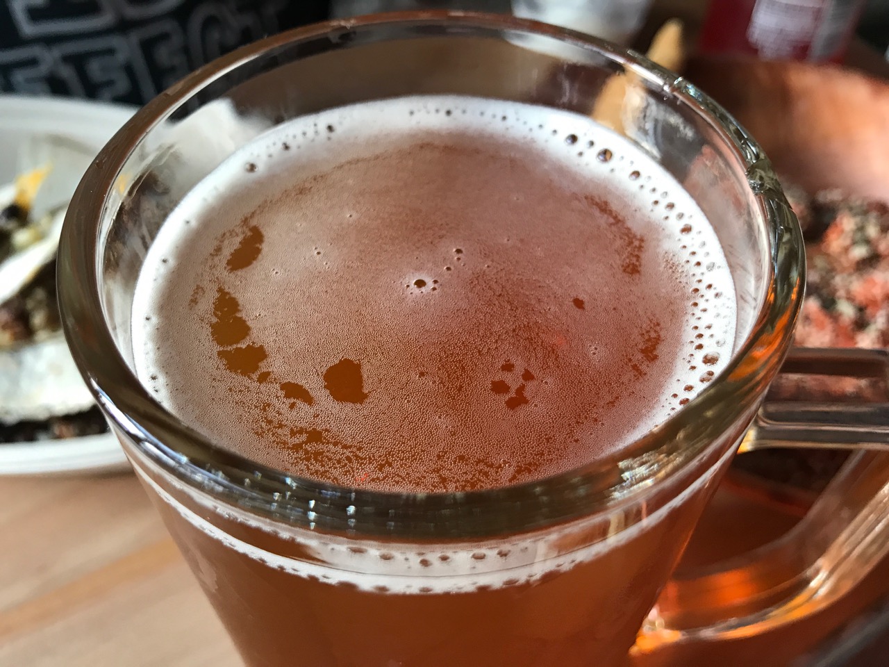 View from above into pint glass of freshly-poured beer