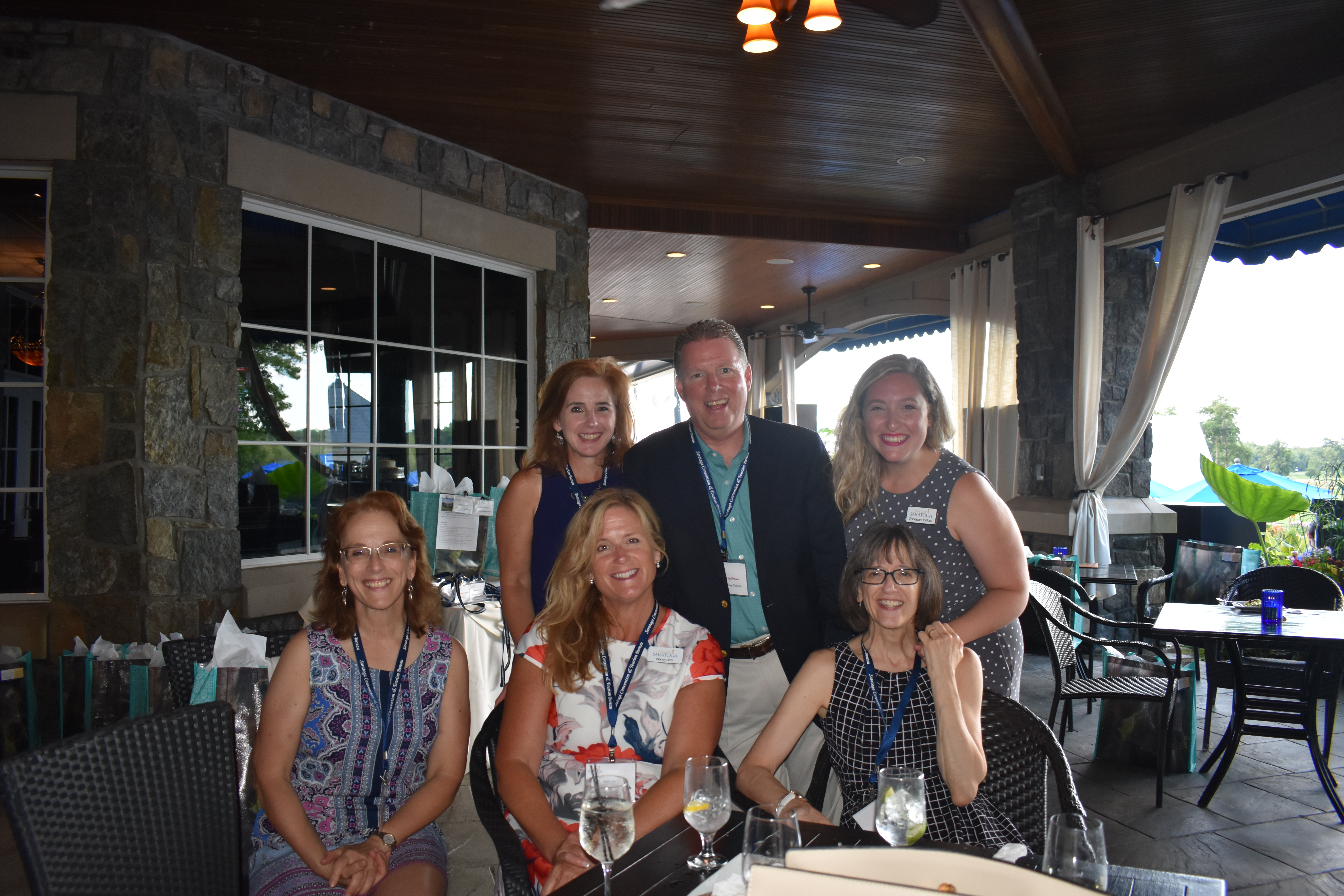 Small group smiling for camera at Saratoga National networking event