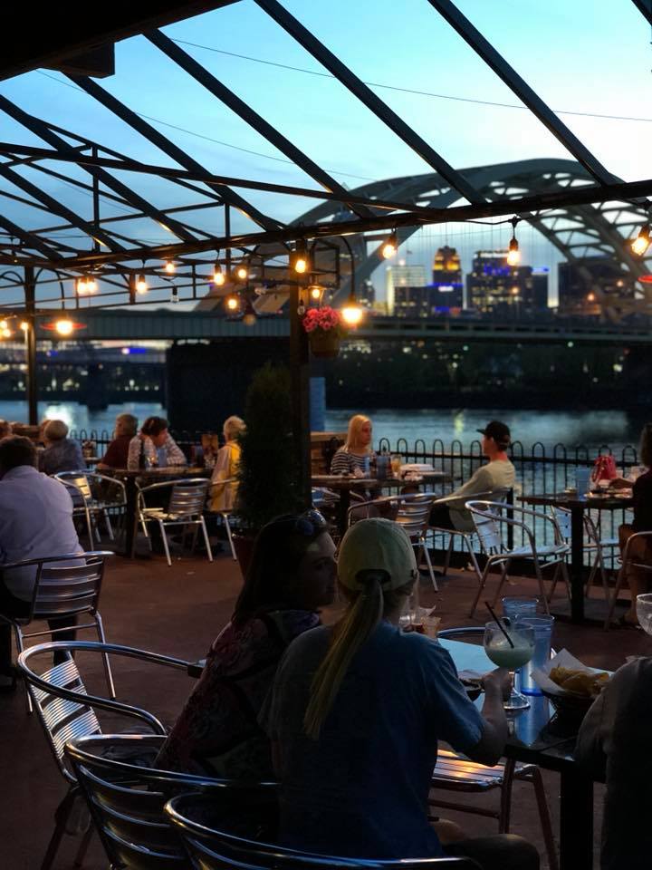 Diners enjoying view of Cincinnati from Cancun Mexican restaurant