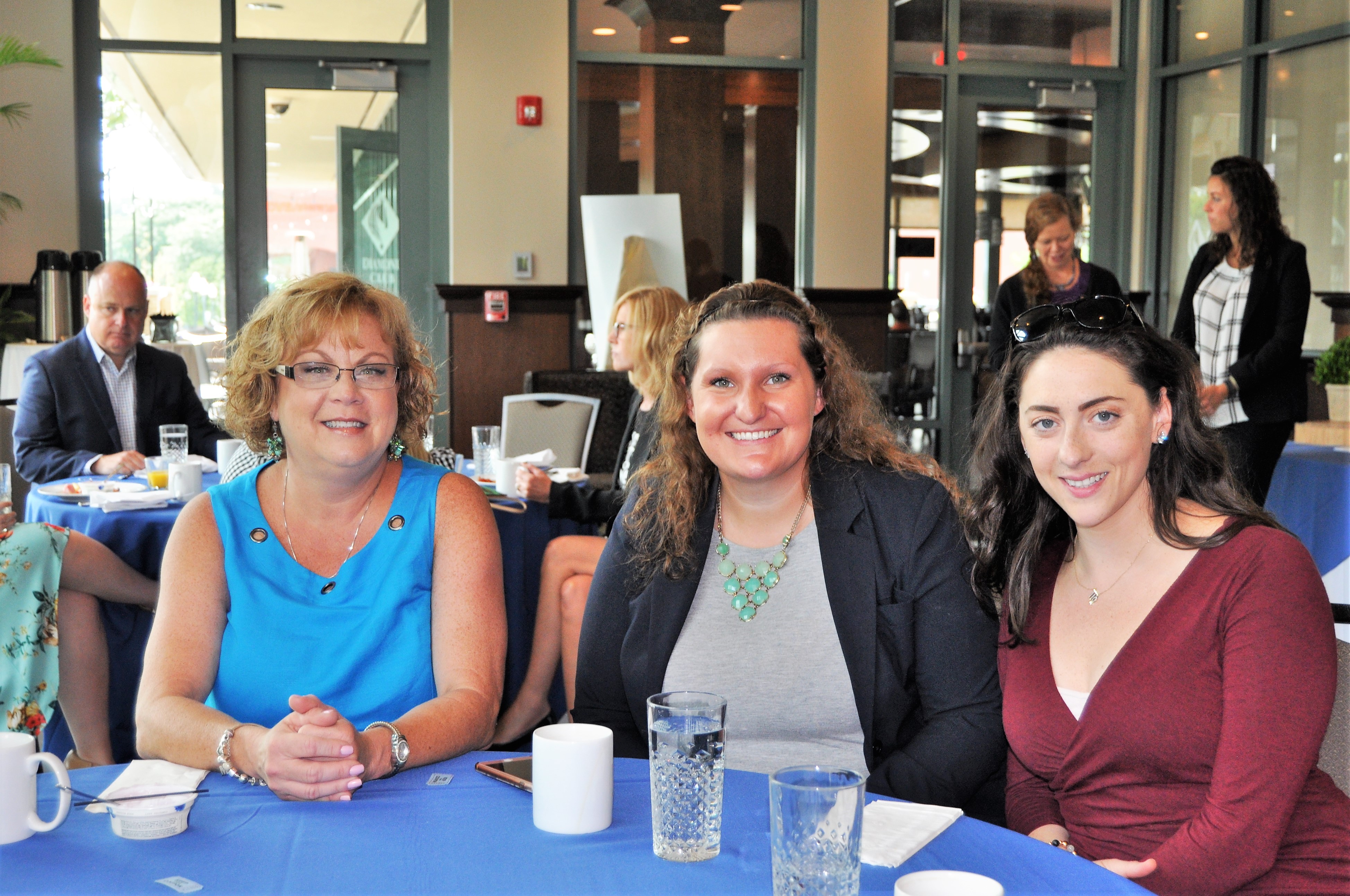 3 women finishing breakfast at table