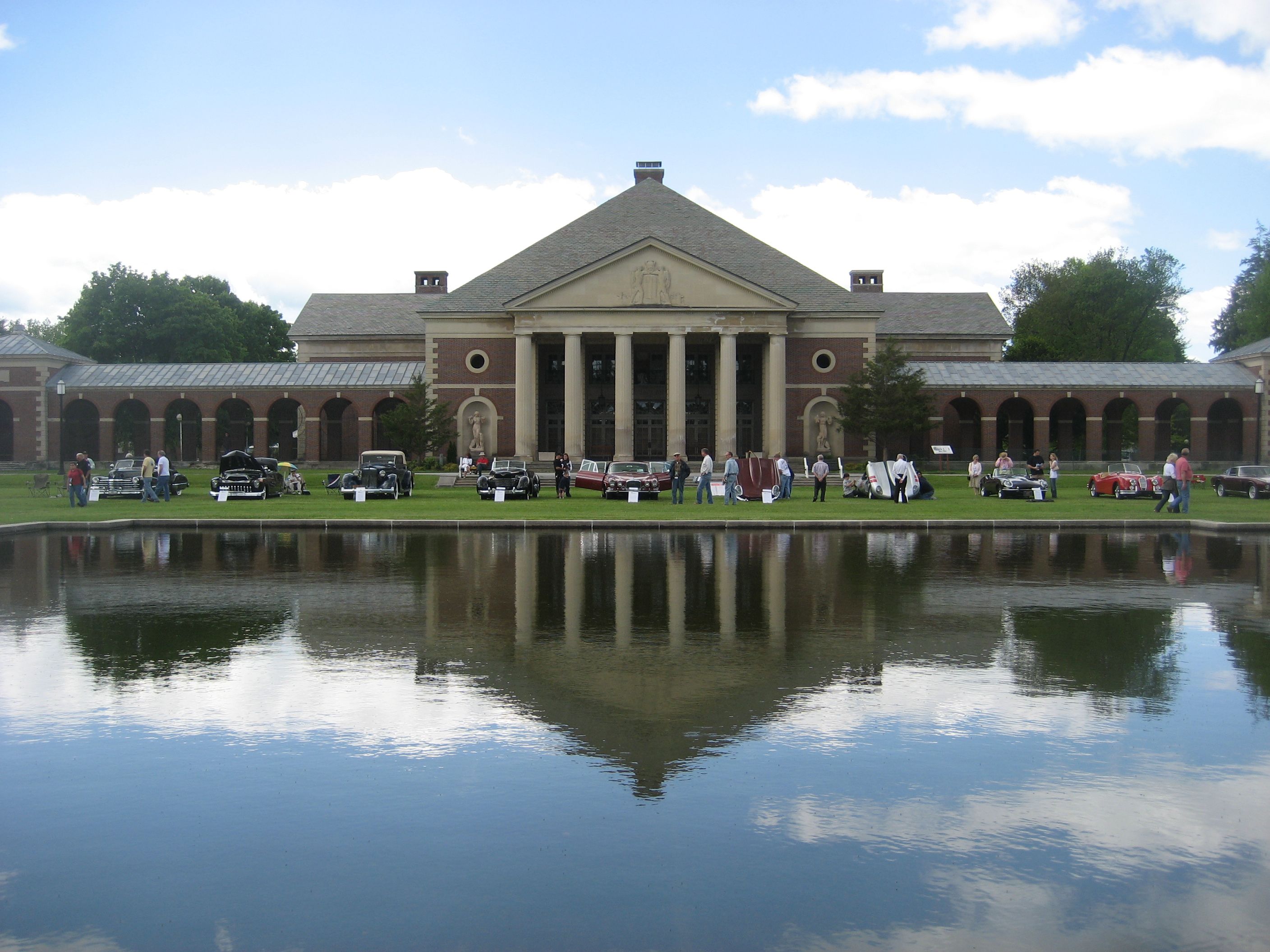 Vintage cars on display at Saratoga Spa State Park reflecting pool