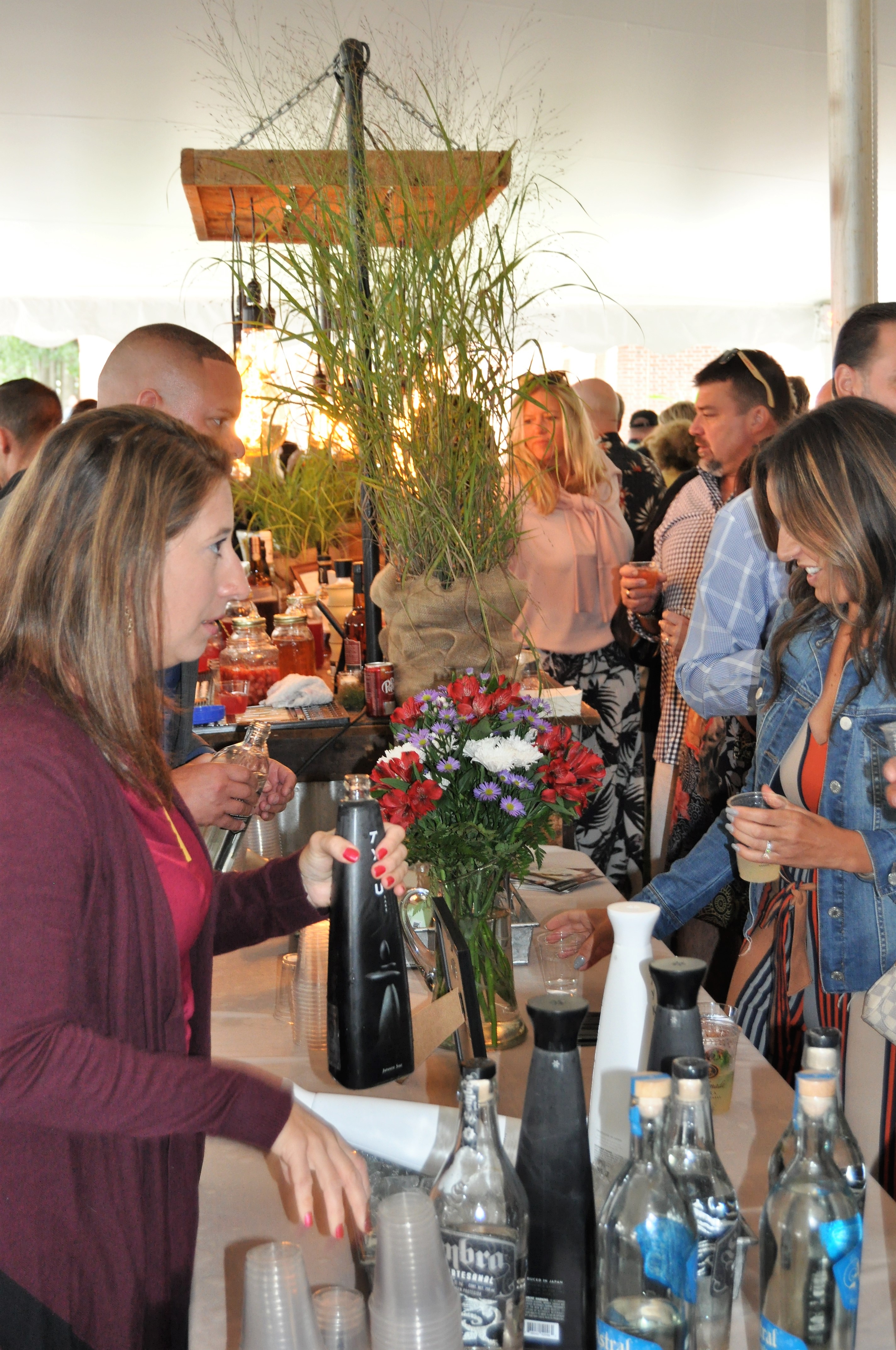 People sampling wine