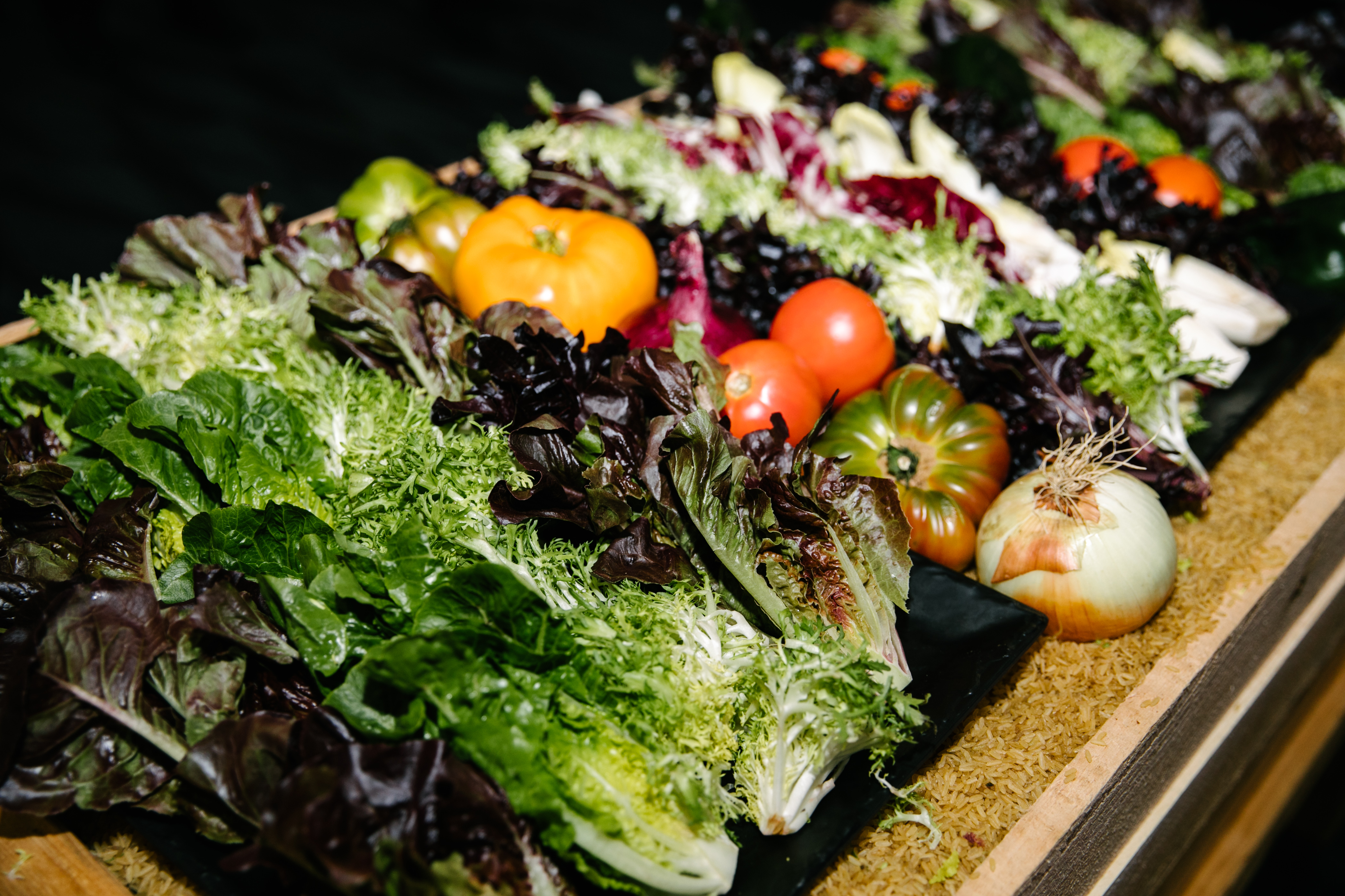 Bowls Of Mixed Fresh Organic Vegetables In Salad Bar Display Wood