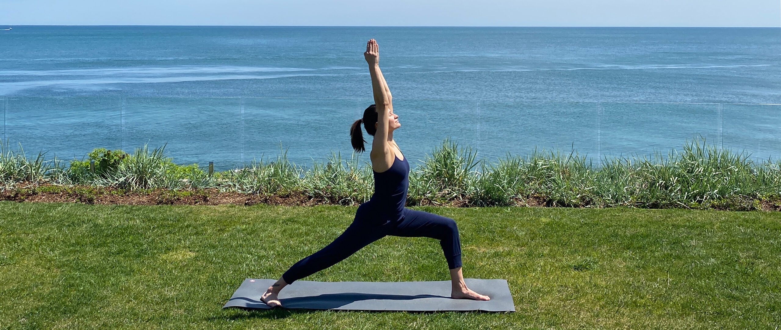 Yoga, zen and back view of black woman at beach on yoga mat