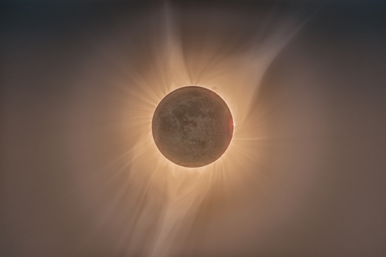 Two views of the Sun during a total solar eclipse. Left: the pink