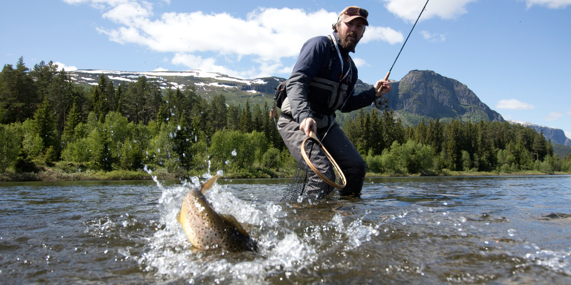 Premium Photo  Woman fishing on fishing rod spinning in norway. fishing in  norway is a way to embrace the local lifestyle. countless lakes and rivers  and an extensive coastline means outstanding